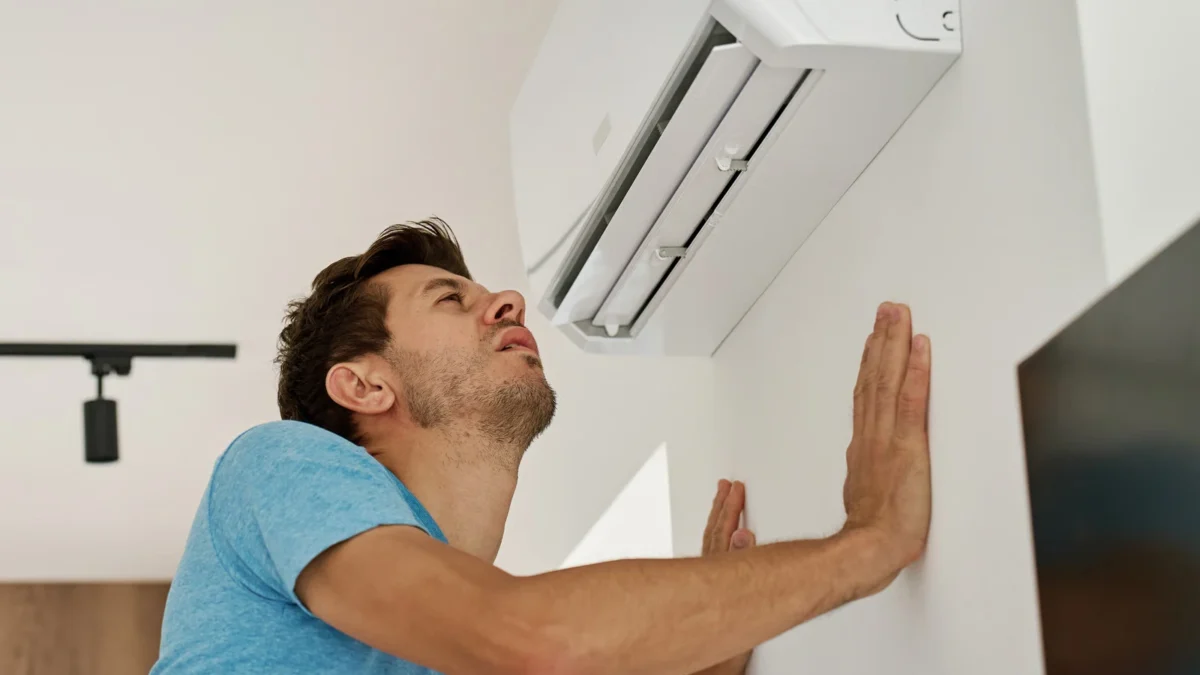 AC blowing warm air on a hot day
