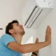 AC blowing warm air on a hot day